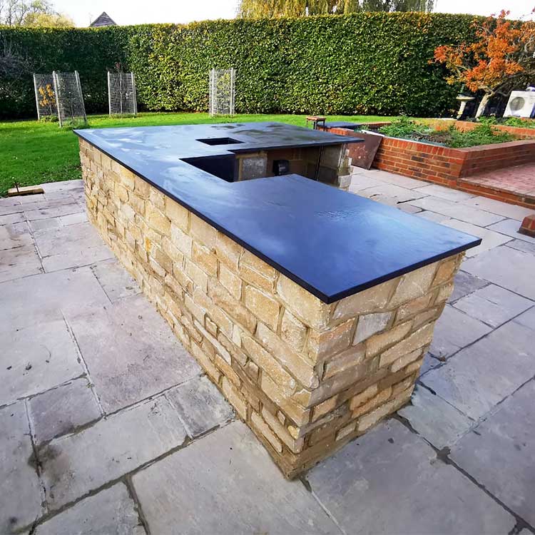 Large black Dekton Sirius outdoor worktops created for a garden bar in Surrey by LBS Stone