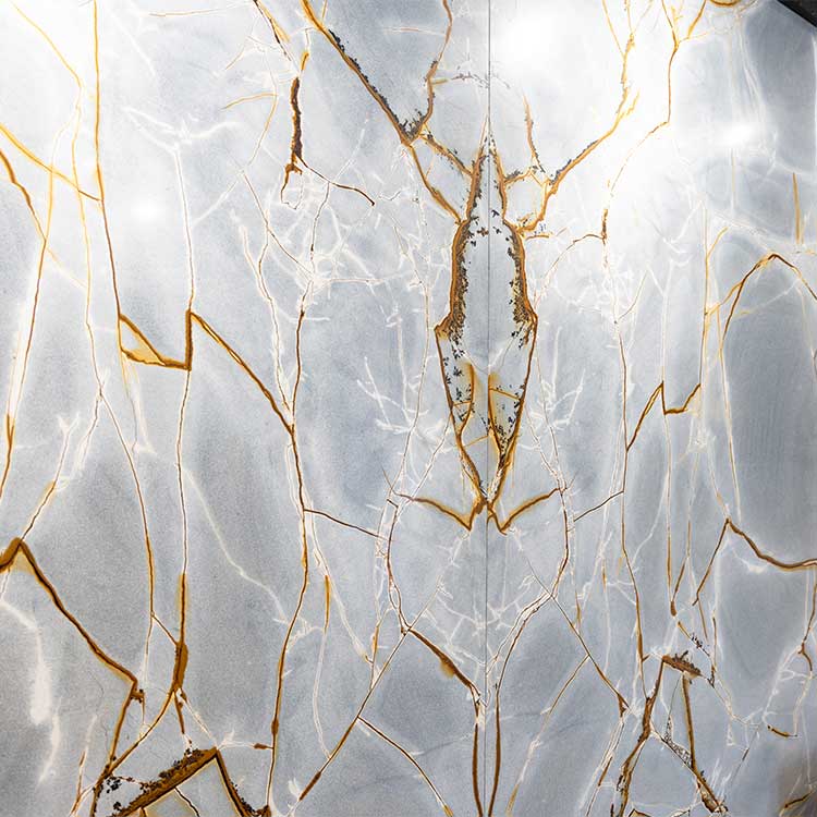 Blue book-matched granite stone wall cladding with gold veining produced by LBS Stone
