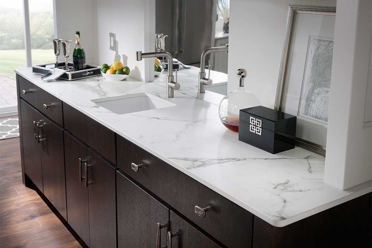 Luxury bathroom with a white marble effect sintered stone vanity top and inset sink